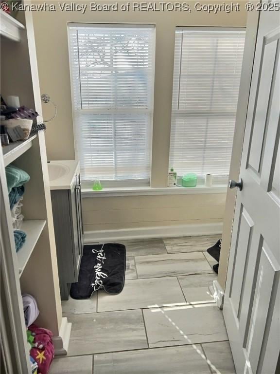 bathroom featuring vanity and baseboards