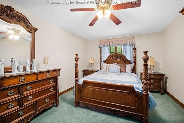 carpeted bedroom featuring baseboards and ceiling fan