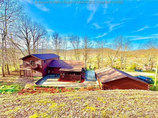 exterior space featuring a wooden deck