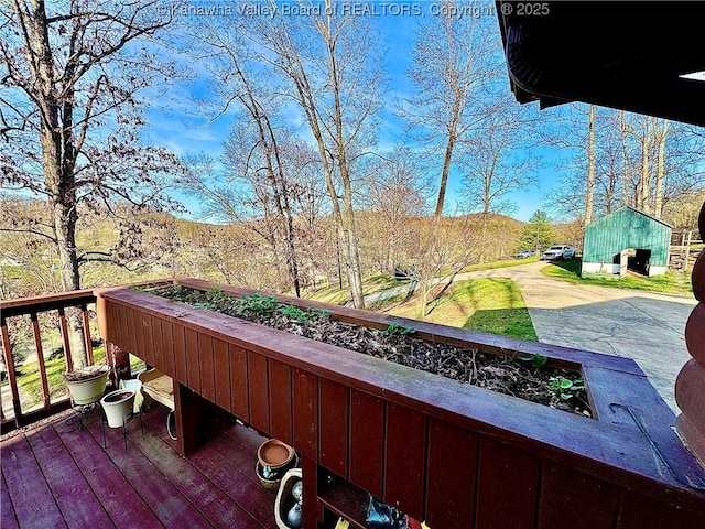 view of wooden balcony with a deck