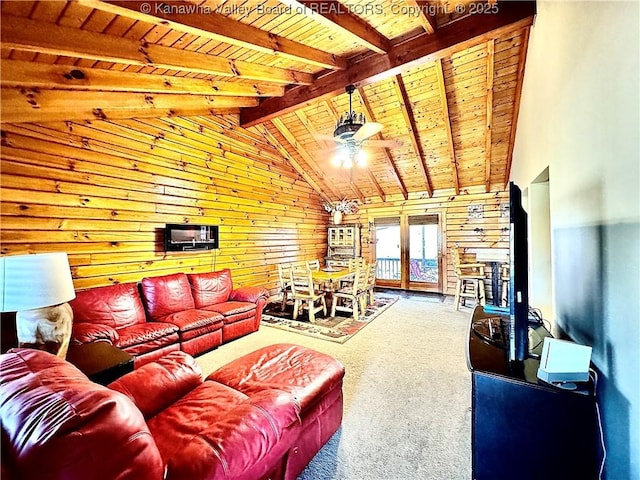 carpeted living area with french doors, a ceiling fan, lofted ceiling with beams, and wood ceiling