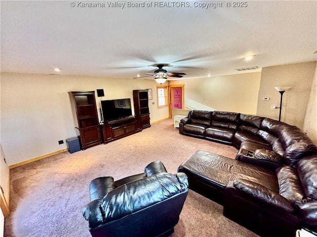 living room featuring ceiling fan, baseboards, visible vents, and carpet floors