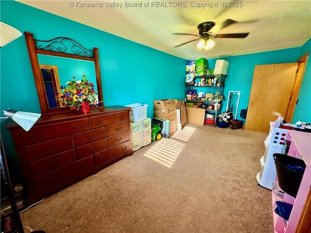bedroom featuring carpet, a textured ceiling, and ceiling fan