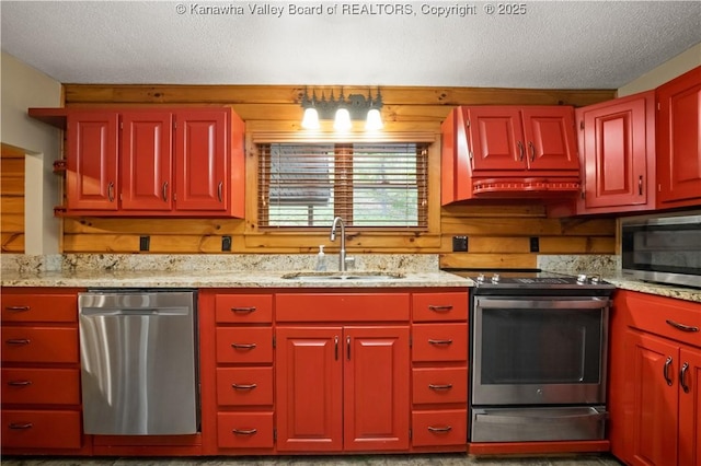 23 Mindia Ln, Alum Creek, WV 25003 - kitchen with stainless steel appliances, a sink, a textured ceiling, and light stone counters