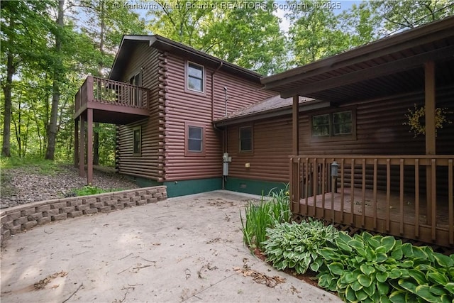 23 Mindia Ln, Alum Creek, WV 25003 - rear view of house with log exterior, a deck, crawl space, and a patio
