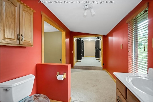 23 Mindia Ln, Alum Creek, WV 25003 - bathroom with toilet, vanity, and lofted ceiling