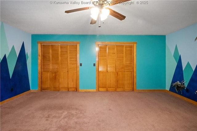 23 Mindia Ln, Alum Creek, WV 25003 - unfurnished bedroom featuring carpet flooring, baseboards, multiple closets, and ceiling fan