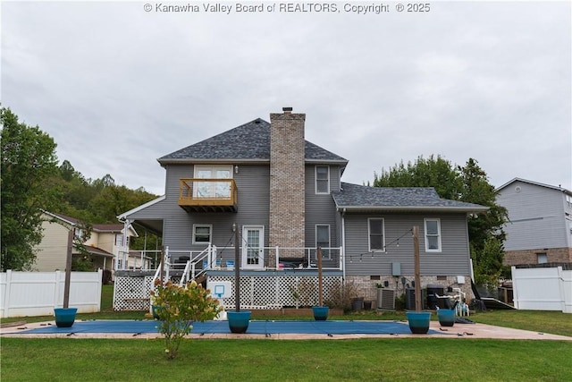 120 Rosewood Dr, Hurricane, WV 25526 - rear view of property with a chimney, roof with shingles, central air condition unit, and a deck