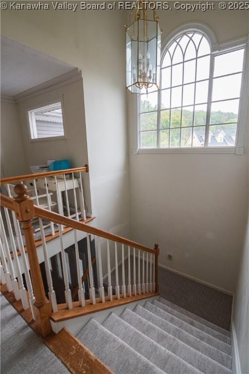 120 Rosewood Dr, Hurricane, WV 25526 - stairway featuring carpet floors, a chandelier, baseboards, and crown molding
