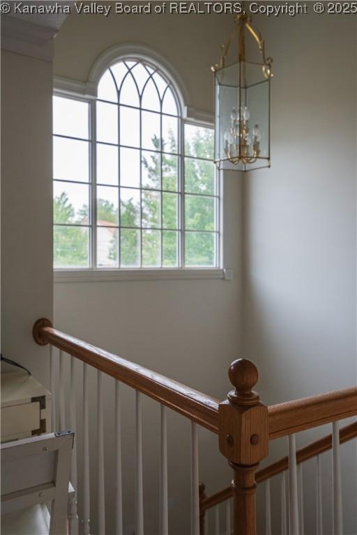 120 Rosewood Dr, Hurricane, WV 25526 - stairs featuring plenty of natural light and a chandelier
