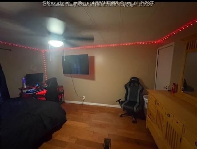 bedroom with baseboards and light wood-style floors