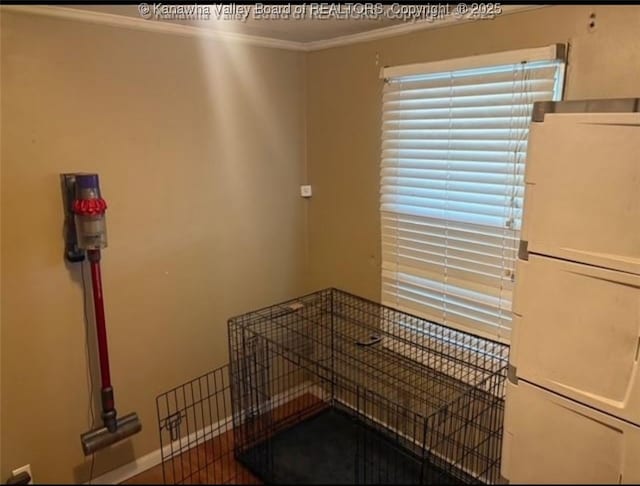 dining space with crown molding
