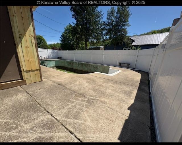 view of swimming pool with a fenced in pool, a patio, and a fenced backyard