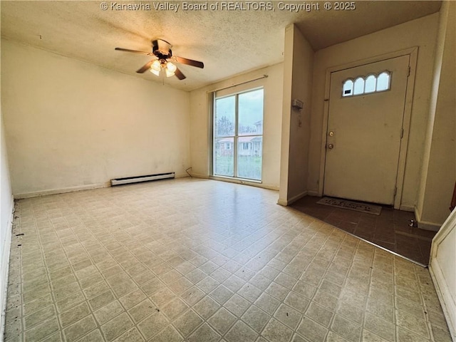 foyer entrance with tile patterned floors, a baseboard radiator, a ceiling fan, and a textured ceiling