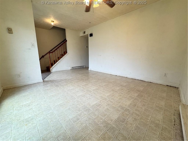 unfurnished living room with baseboards, tile patterned floors, stairs, ceiling fan, and a baseboard radiator