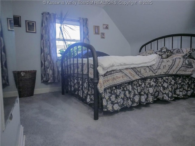 carpeted bedroom with vaulted ceiling