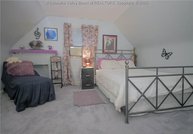 bedroom with lofted ceiling and carpet floors