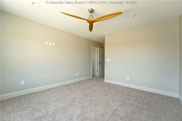 unfurnished room with visible vents, baseboards, a ceiling fan, and carpet flooring