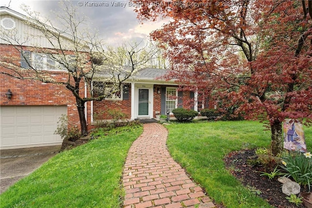 906 Hughes Dr, Saint Albans, WV 25177 - view of front of house featuring concrete driveway, a front yard, and brick siding