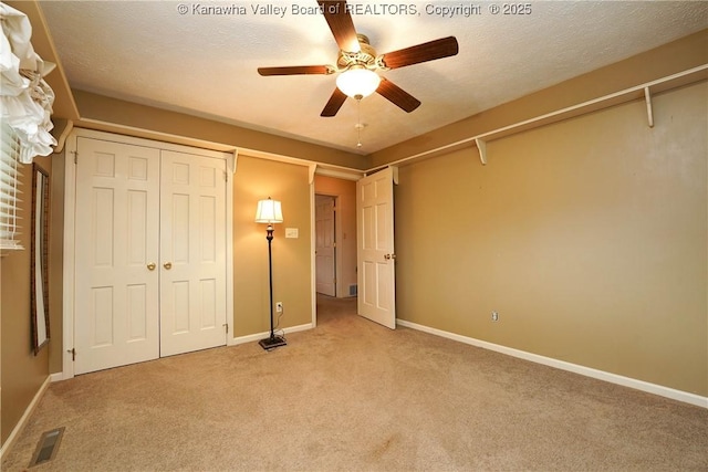 906 Hughes Dr, Saint Albans, WV 25177 - unfurnished bedroom with light carpet, baseboards, visible vents, and a textured ceiling
