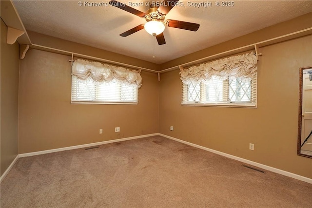 906 Hughes Dr, Saint Albans, WV 25177 - carpeted empty room featuring baseboards, visible vents, a textured ceiling, and a ceiling fan