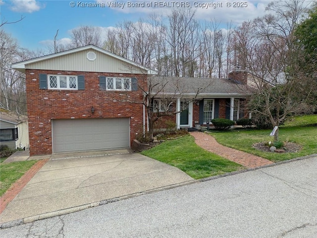 906 Hughes Dr, Saint Albans, WV 25177 - split level home with brick siding, a front yard, an attached garage, and concrete driveway