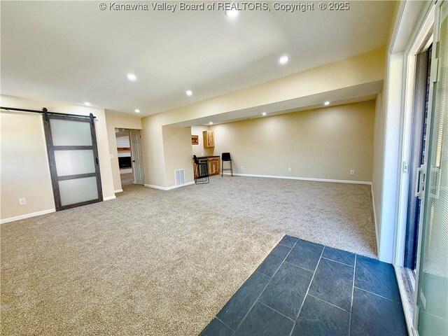 219 Westmoreland Dr, Dunbar, WV 25064 - interior space featuring baseboards, recessed lighting, dark colored carpet, and a barn door