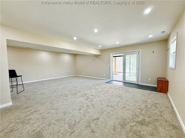 empty room featuring recessed lighting, visible vents, baseboards, and carpet floors