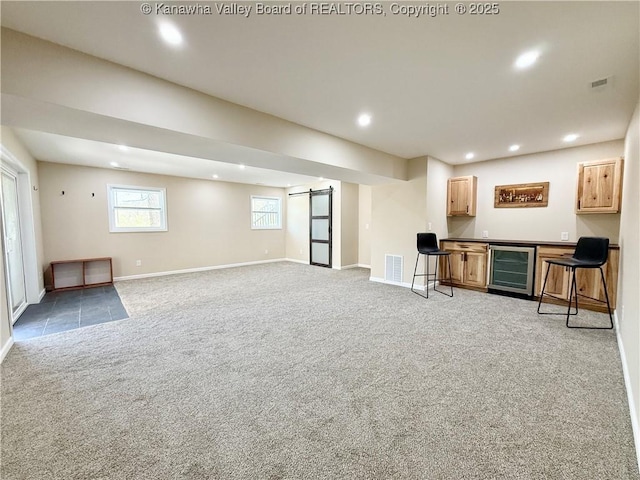 interior space with a bar, wine cooler, carpet, and visible vents
