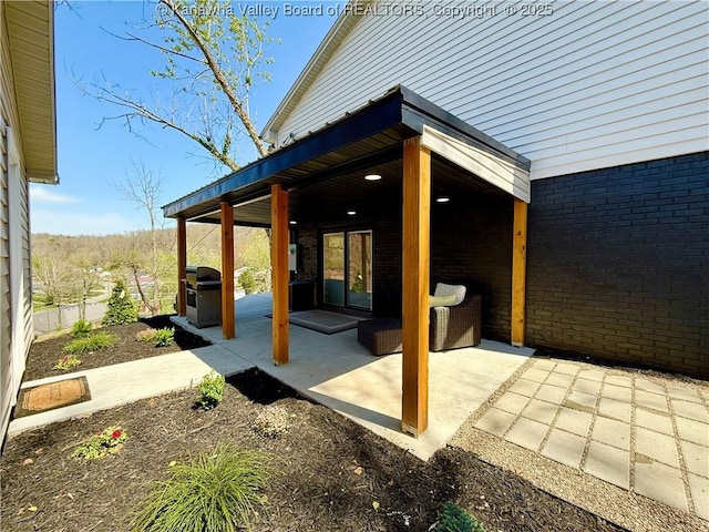 view of patio featuring a grill