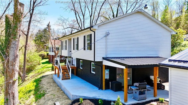 back of house featuring a patio