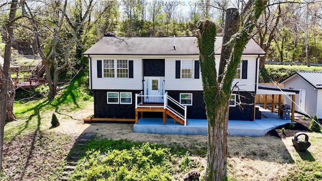 rear view of property featuring a patio