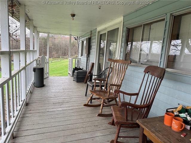 wooden terrace with a porch