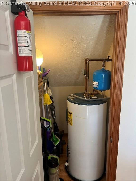 utility room with water heater