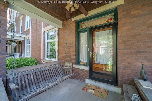 12 Arlington Ct, Charleston, WV 25301 - doorway to property with brick siding, a porch, a ceiling fan, and central AC unit