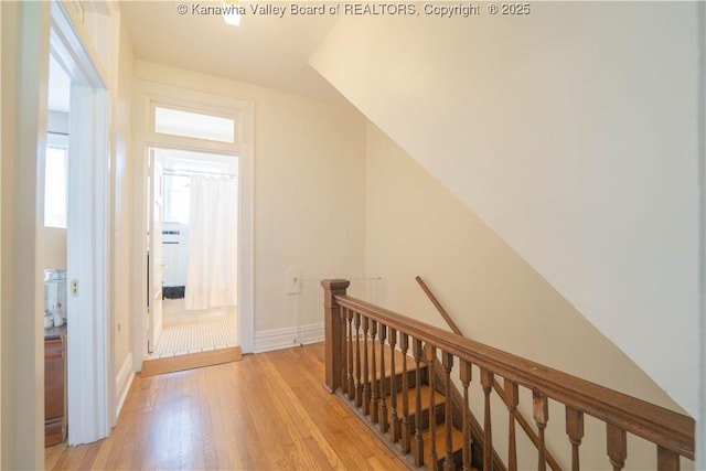 12 Arlington Ct, Charleston, WV 25301 - hallway with light wood-style flooring, baseboards, and an upstairs landing