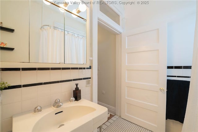 12 Arlington Ct, Charleston, WV 25301 - full bathroom with a sink, tile walls, and tile patterned floors