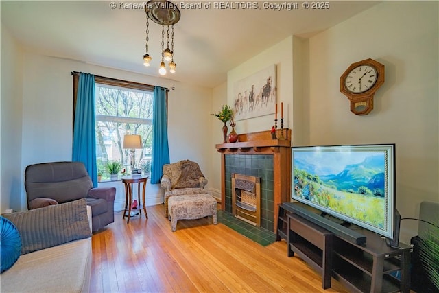 12 Arlington Ct, Charleston, WV 25301 - sitting room with a tile fireplace, hardwood / wood-style flooring, and baseboards