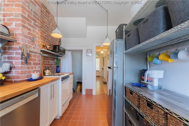 12 Arlington Ct, Charleston, WV 25301 - kitchen with butcher block countertops, white cabinetry, decorative light fixtures, and stainless steel appliances
