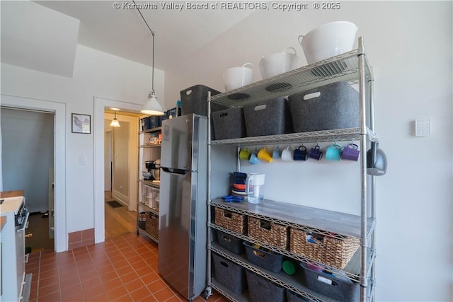12 Arlington Ct, Charleston, WV 25301 - kitchen with tile patterned floors, decorative light fixtures, freestanding refrigerator, and white electric range oven