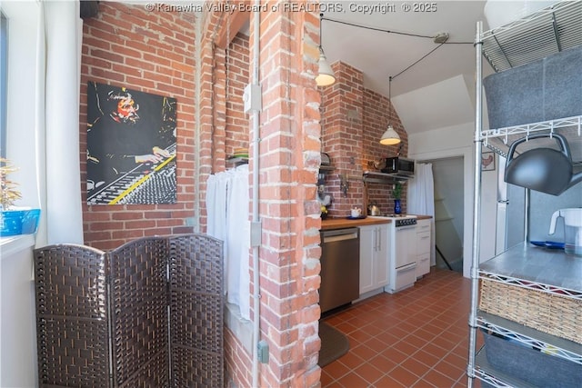 12 Arlington Ct, Charleston, WV 25301 - kitchen featuring vaulted ceiling, tile patterned floors, white gas range, white cabinets, and stainless steel dishwasher