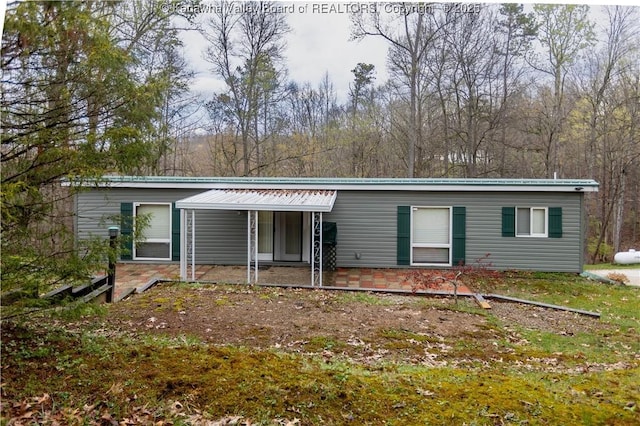 view of front of property featuring a patio area