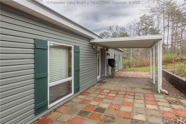 view of patio / terrace featuring a carport