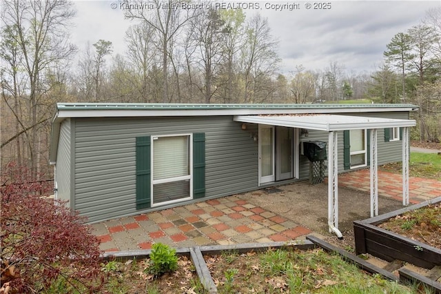 rear view of house with a patio