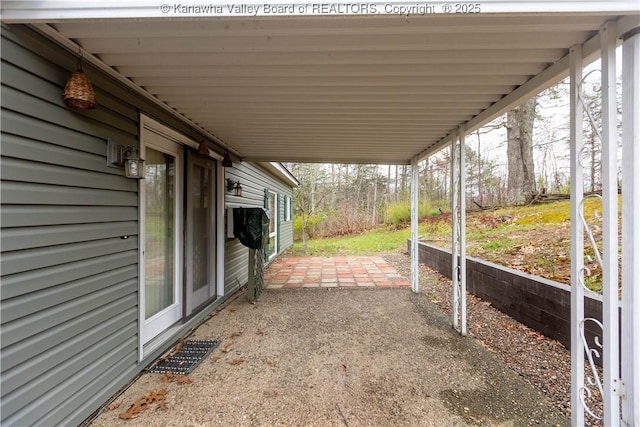 view of patio featuring a carport and visible vents