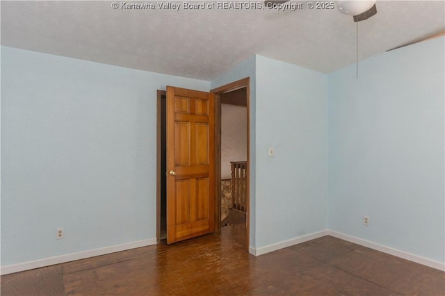 unfurnished room featuring baseboards