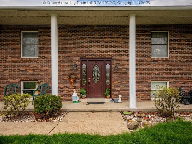 139 Betty Ln, Scott Depot, WV 25560 - doorway to property featuring covered porch and brick siding