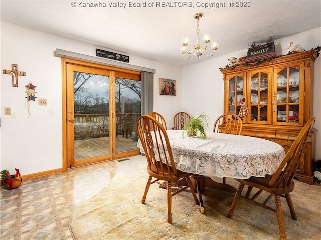 139 Betty Ln, Scott Depot, WV 25560 - dining area featuring a chandelier, visible vents, baseboards, and light floors