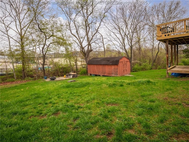 139 Betty Ln, Scott Depot, WV 25560 - view of yard with a storage unit, a wooden deck, and an outdoor structure