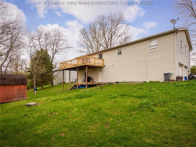 139 Betty Ln, Scott Depot, WV 25560 - back of property featuring an outdoor structure, a wooden deck, a lawn, and a storage unit